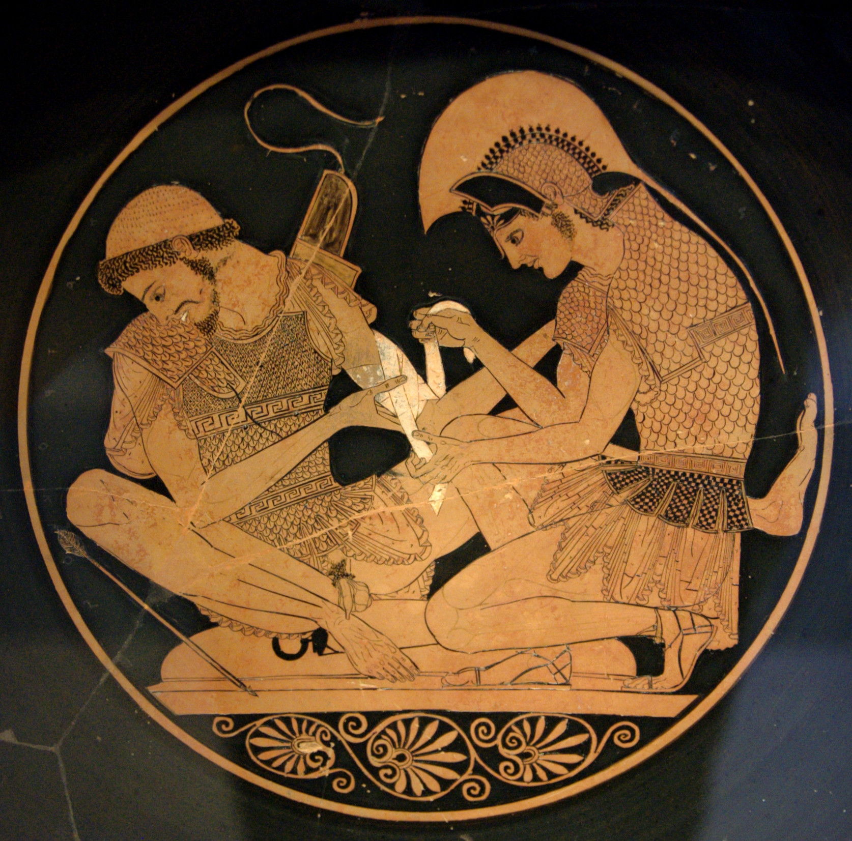 Achilles tending Patroclus wounded by an arrow, Attic red-figure kylix, c. 500 BCE (Altes Museum, Berlin) –Wikimedia commons  
